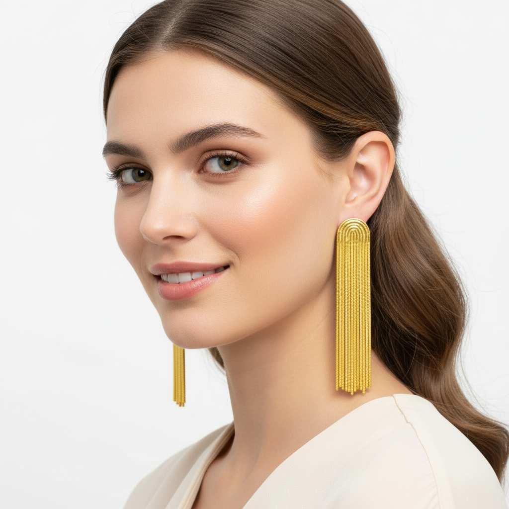 Woman wearing gold tassel earrings
